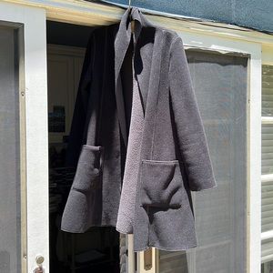 Jacket black grey lined big pockets no buttons shawl collar. Brand is chameleon